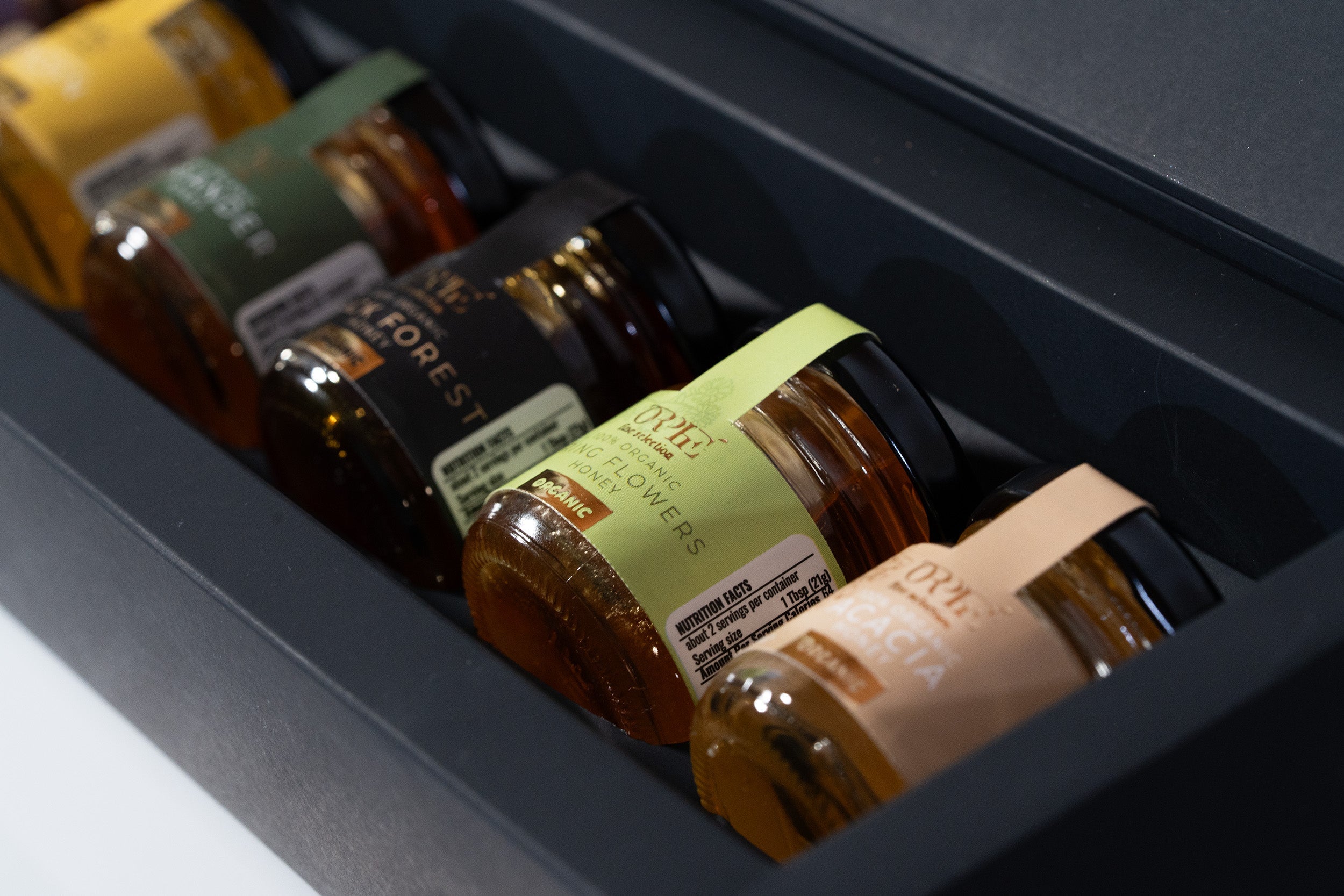 Orphe Luxury Organic Honey Sets feature raw Bulgarian honeys—Lavender, Forest Honeydew, Acacia, Rose, Linden, Sunflower—with a gold-plated spoon. Perfect for gifting, tea, coffee, and gourmet use.