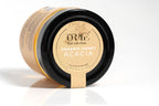 Clear glass jar of Orlé organic honey with a sleek black lid, filled with rich golden amber honey. The jar features a clean, minimalist label showcasing the Orlé brand, and is photographed against a bright white background for a fresh, professional presentation.

