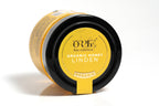 "Orfe brand organic honey in a clear container with a bright yellow label, featuring clean branding and product details. The container is filled with rich golden amber honey and is photographed against a white background for a fresh, professional look.