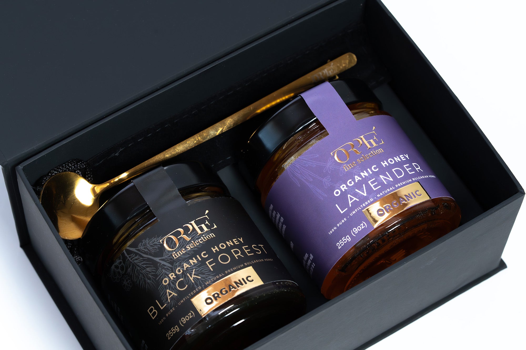 ORPHE gift pack is premium gift containing Two jars of organic honey in a black box with a gold spoon.
